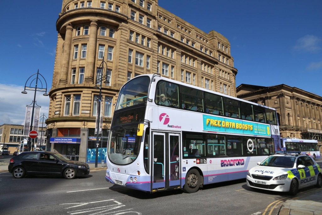 BRADFORD UK - JULY 11 2016: People ride First Bradford double decker bus. FirstGBradford (Yorkshire) City Centre